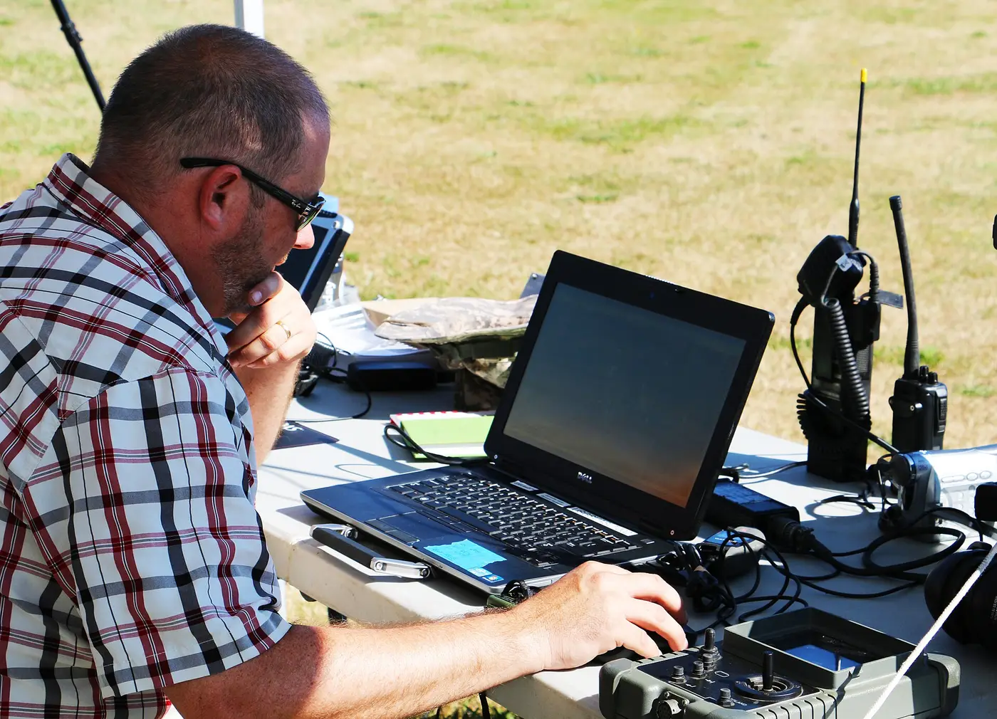 Small multirotor on a launch mat in a field before a USGS research flight