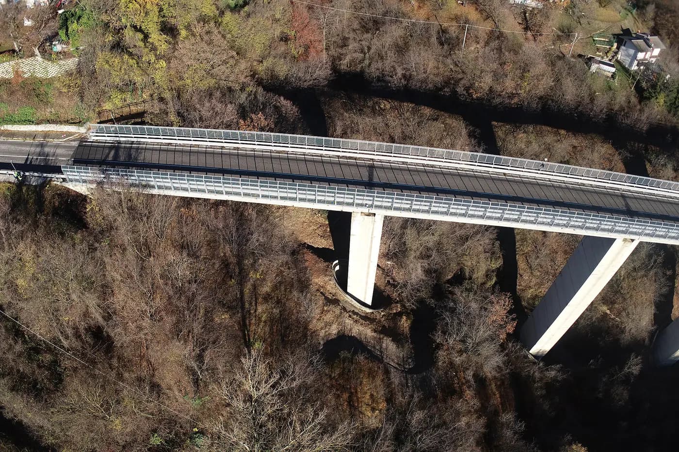A drone's view of a concrete bridge deck and piers during an inspection